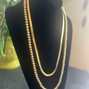 Vintage Monet Necklaces. Gold Tone Flat Cain and Beaded (on Chain). Lot of two.